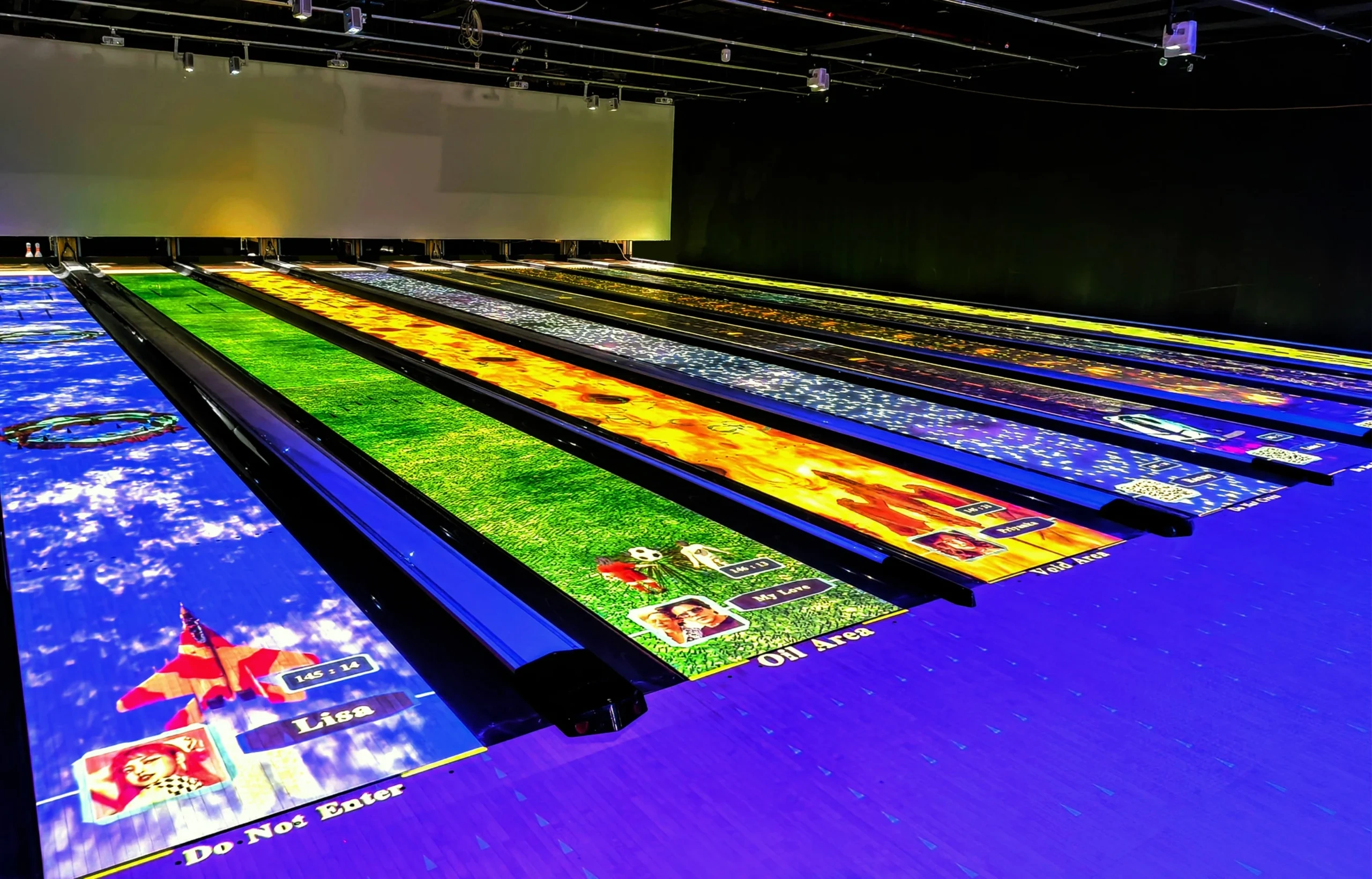 lose-up view of bowling alley lanes featuring augmented reality bowling games, highlighting interactive elements.