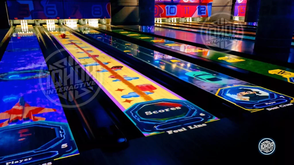 Four interactive AR bowling lanes with IQHDA Interactive projection games, including a moving ball on lane 6
