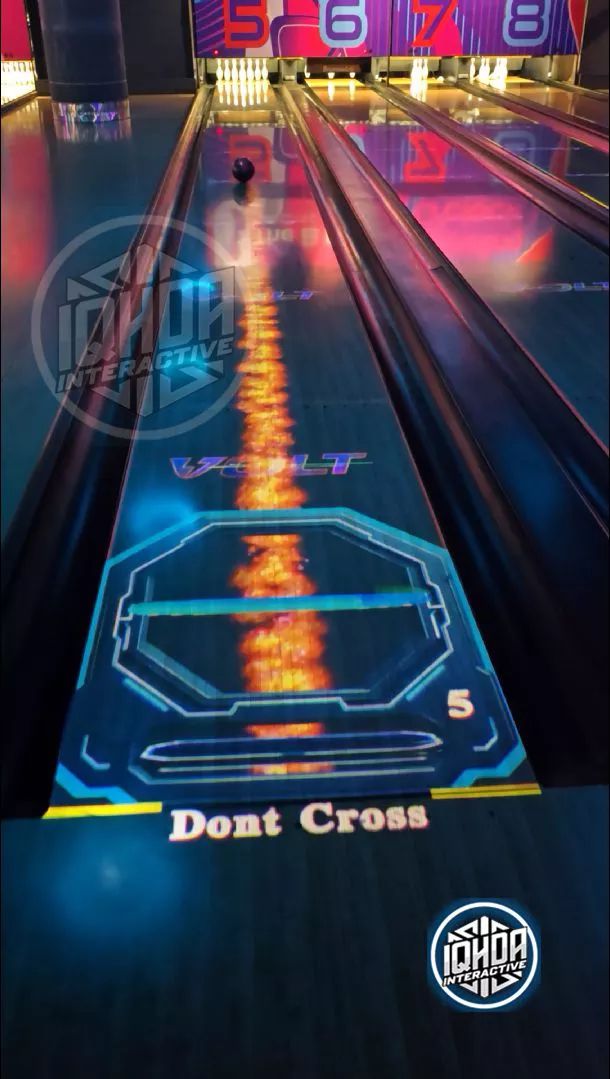 Fire flame themed AR bowling projection by IQHDA Interactive on lane 5
